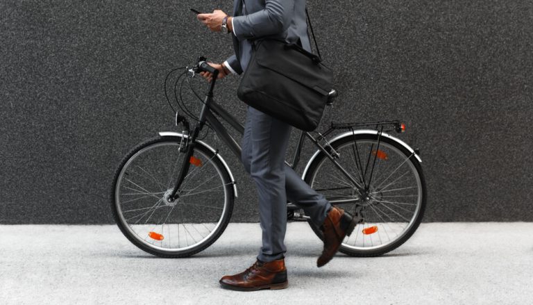 Businessman going to office by his bicycle