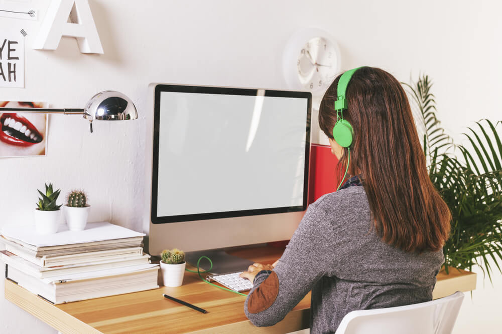 Girl working at modern creative ergonomic workspace