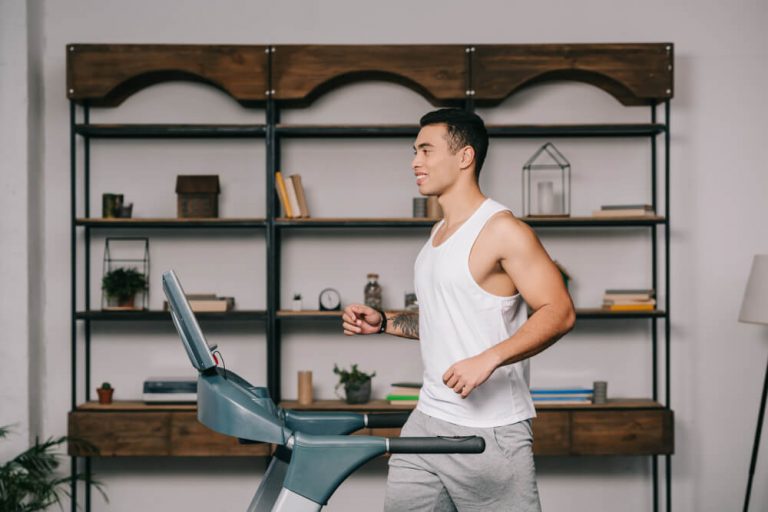 asian man running on treadmill workstation