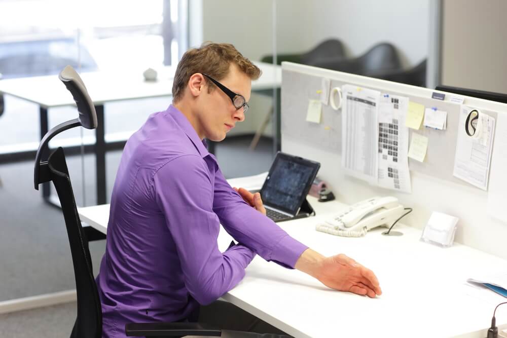 office employee is exercising during work