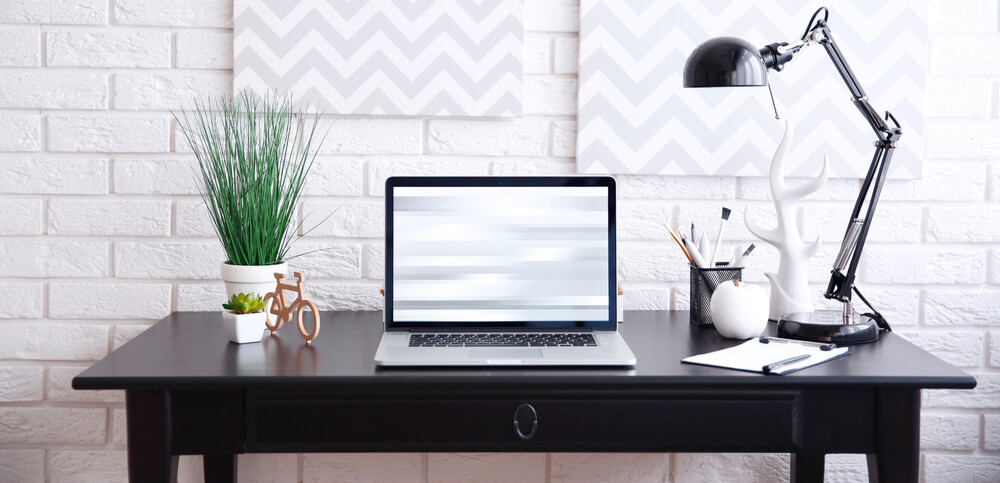 Standing workplace with the laptop on the desktop