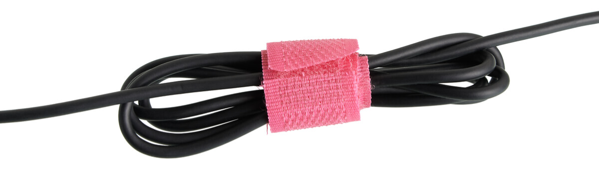 a wire with a velcro clamp an a white background